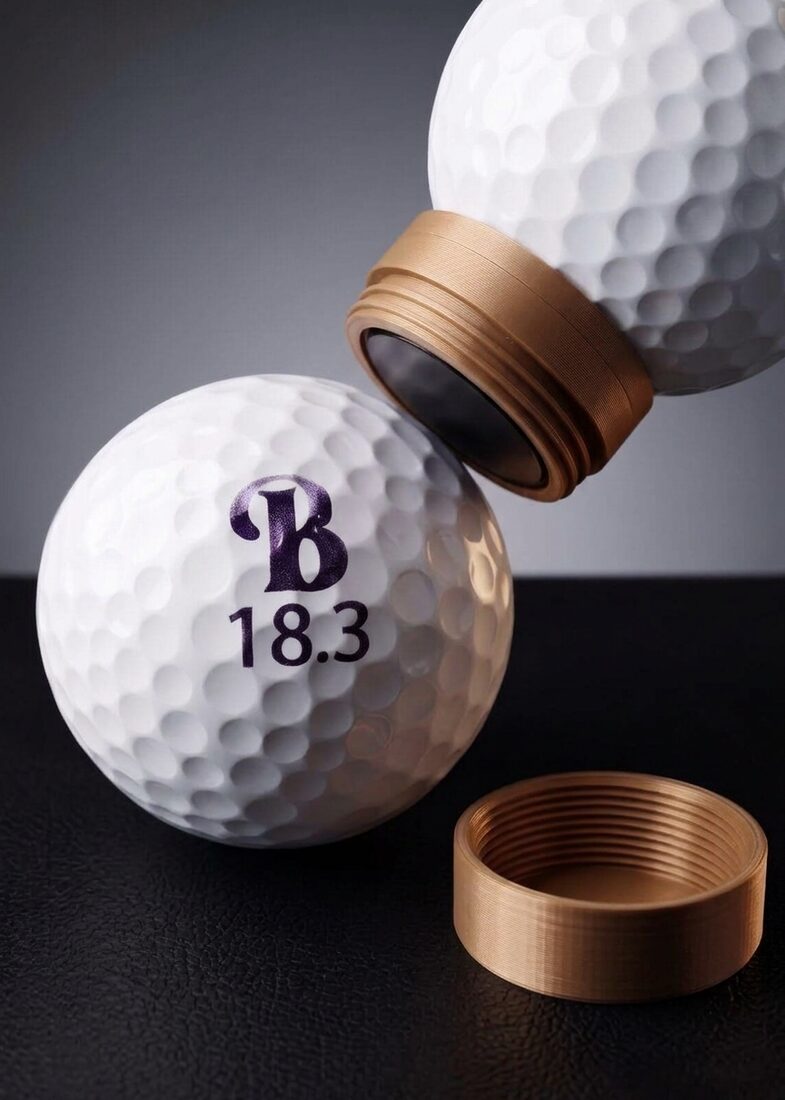 Golf ball stamped with a B monogram and the number 18.3