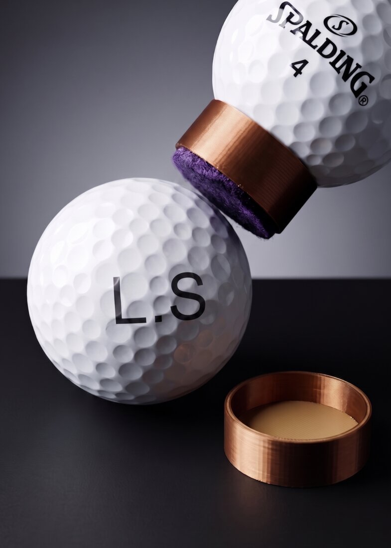 Golf ball stamped with a custom initials mark